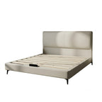 ANJU low profile bed frame with beige padded headboard and slatted base, angled view on a white background