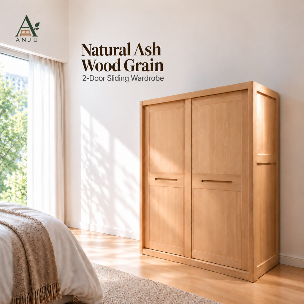 Natural 2-door sliding wardrobe with closed doors in a sunlit bedroom beside a bed