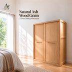 Natural 2-door sliding wardrobe with closed doors in a sunlit bedroom beside a bed