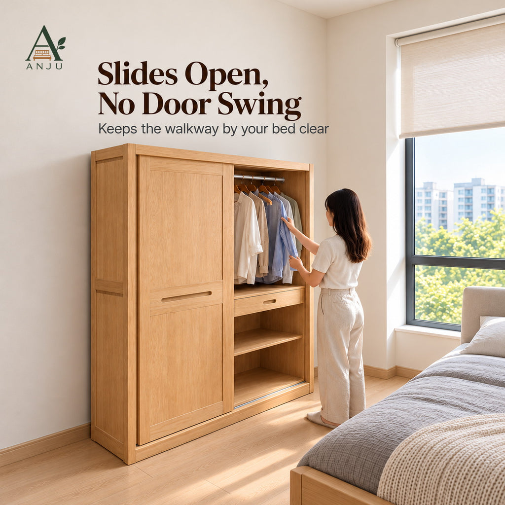 Natural 2-door sliding wardrobe with one door slid open, showing hanging shirts, a drawer and shelves, woman reaching in
