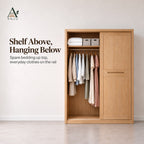 Natural sliding wardrobe with one door slid across, showing a top shelf with bedding and a rail of hanging clothes