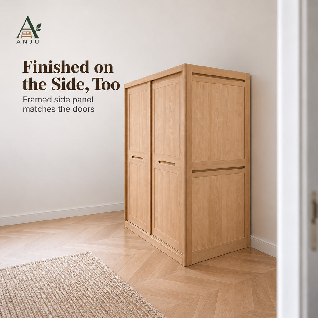 Closed natural 2-door sliding wardrobe seen from the side in a room corner, showing the framed side panel