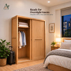 Natural sliding wardrobe with the door slid right, showing folded linen on a shelf and shirts on a rail in a bedroom