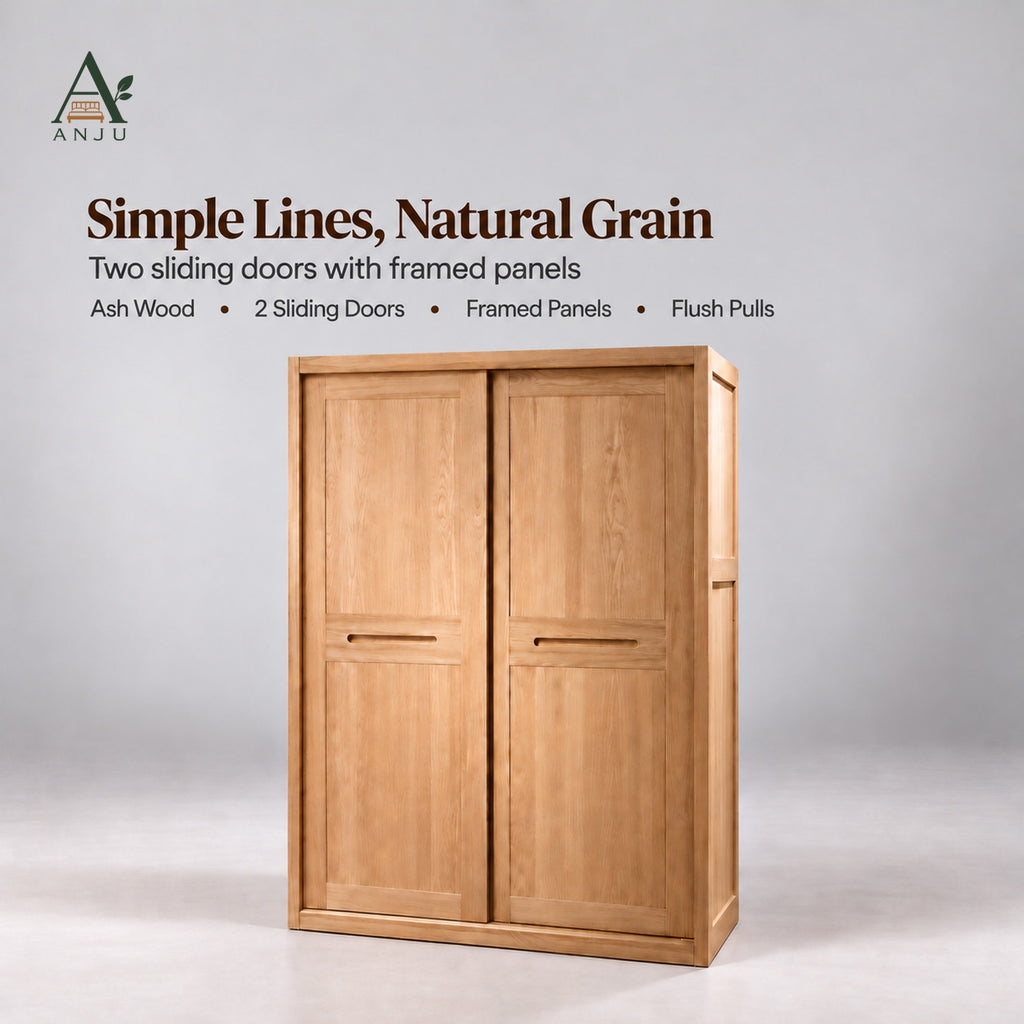 Closed natural 2-door sliding wardrobe with framed panels and recessed pulls on a plain grey studio background