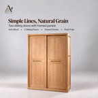 Closed natural 2-door sliding wardrobe with framed panels and recessed pulls on a plain grey studio background