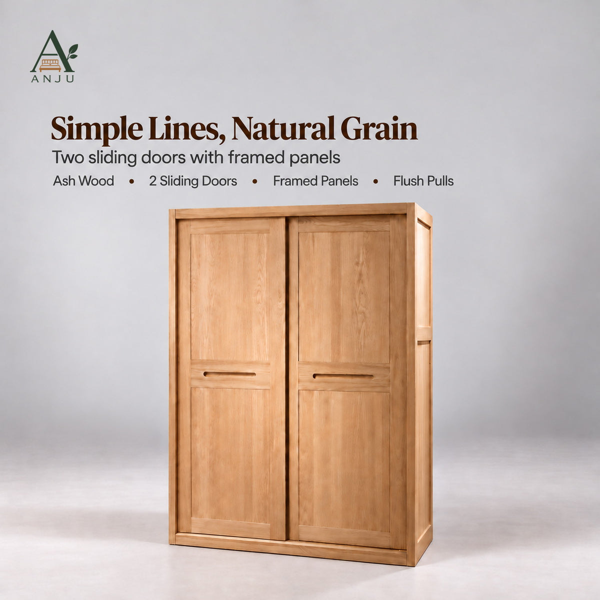 Closed natural 2-door sliding wardrobe with framed panels and recessed pulls on a plain grey studio background