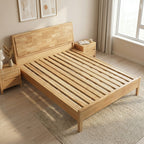ANJU solid wood bed frame with headboard and wide slat base shown without mattress in a sunlit bedroom