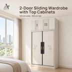 White 2-door sliding wardrobe with top cabinets and embossed elk motifs in a bright bedroom with a bed and window