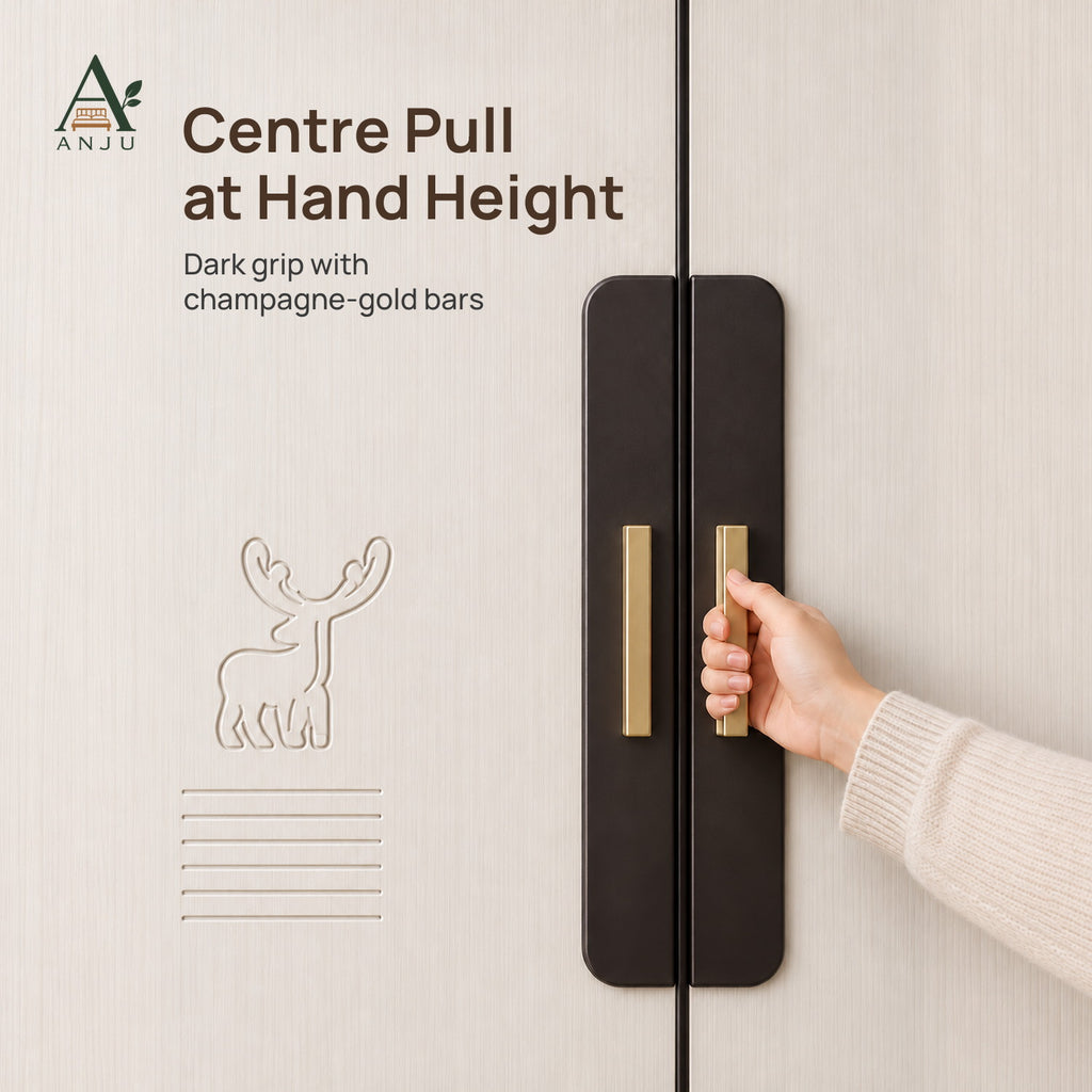 Hand gripping the dark centre pull with gold bars on a white wood-grain sliding wardrobe door