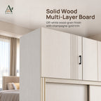 Close-up of the top cabinet doors on a white wood-grain wardrobe, with vertical grooves, a black handle and gold trim